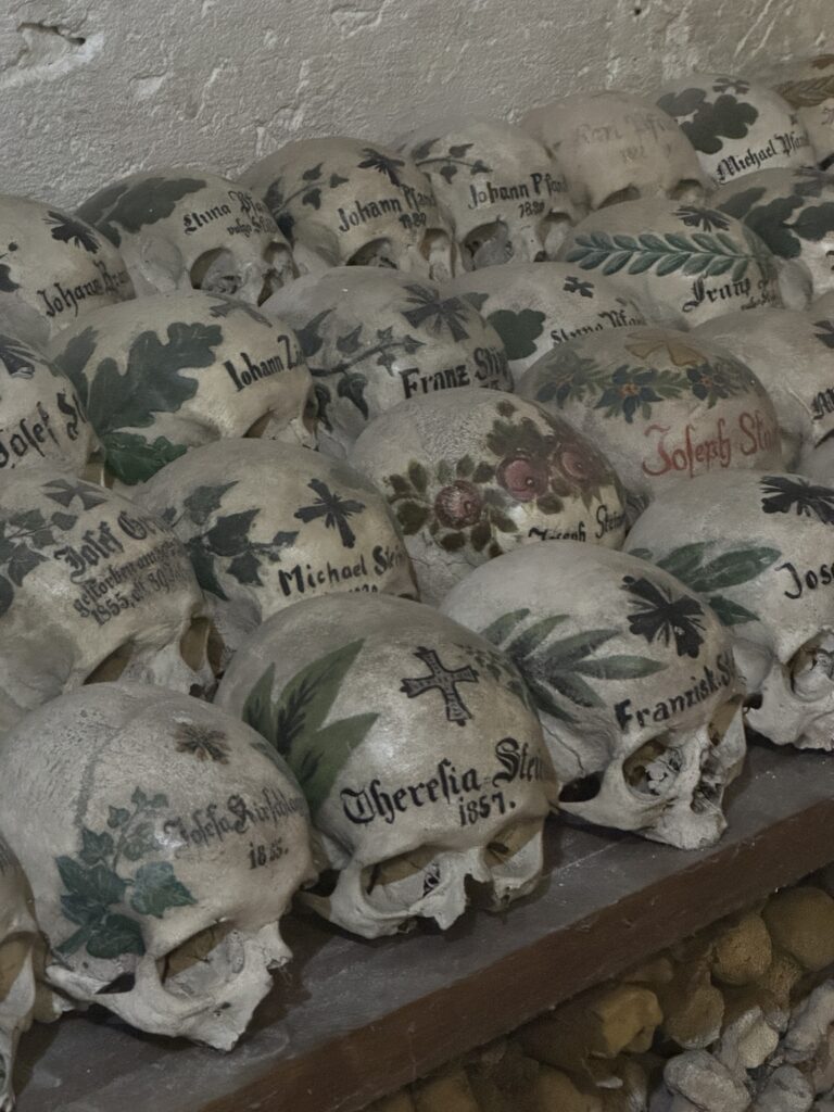 Painted human skulls inside the Hallstatt Bone House in Austria