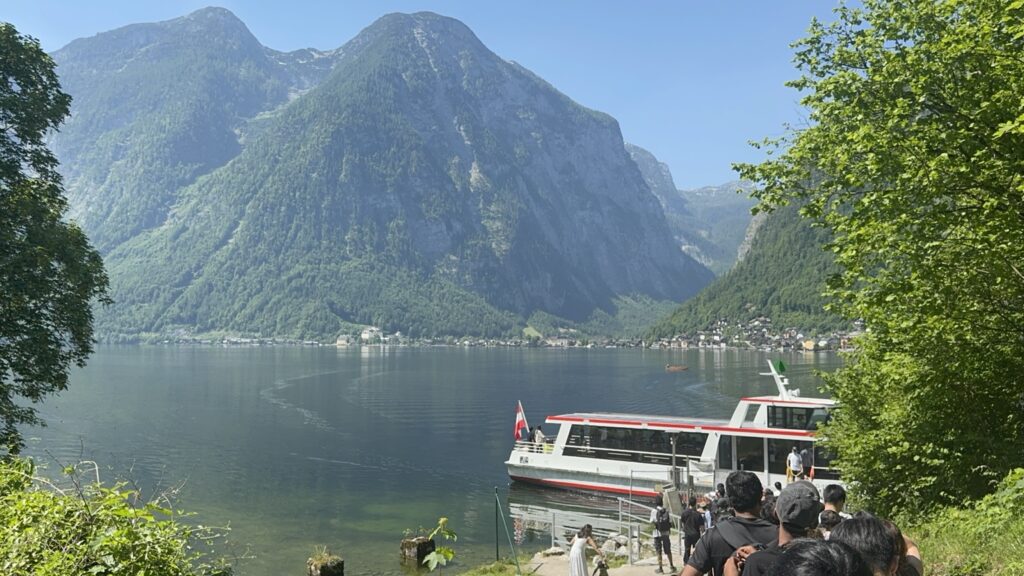 Ferry arriving at Hallstatt village on Lake Hallstatt Austria